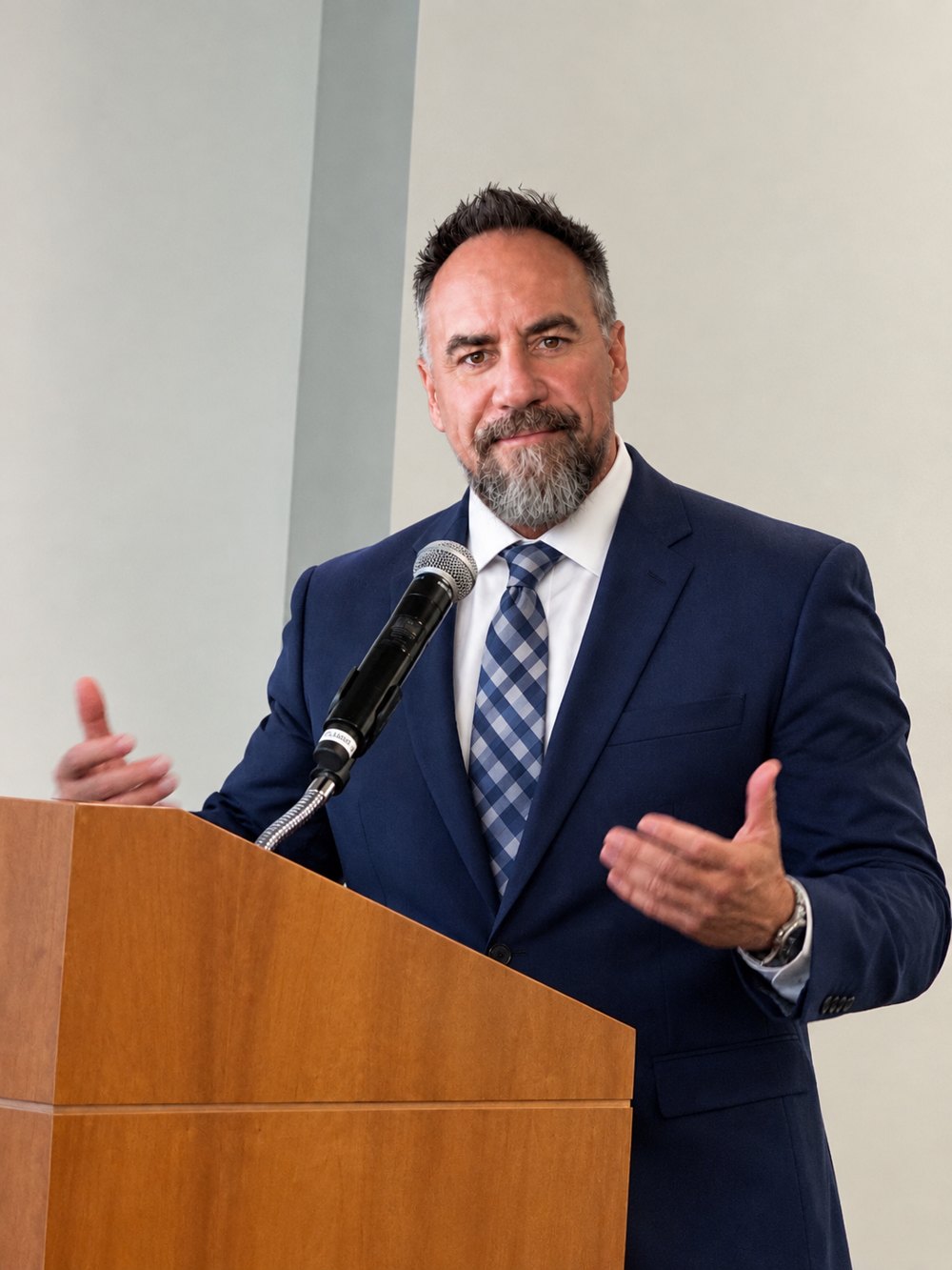 Brent LaJeunesse speaking at a podium